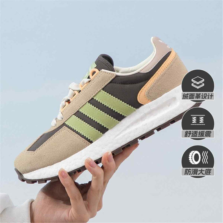 Adidas Clover classic sneaker with BOOST technology, suede materials, earthy tones, green accents.