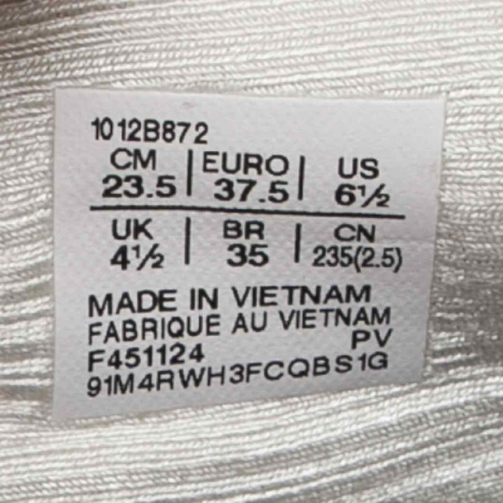 Label showing shoe size conversions for ASICS Gel-Nimbus 27, made in Vietnam.