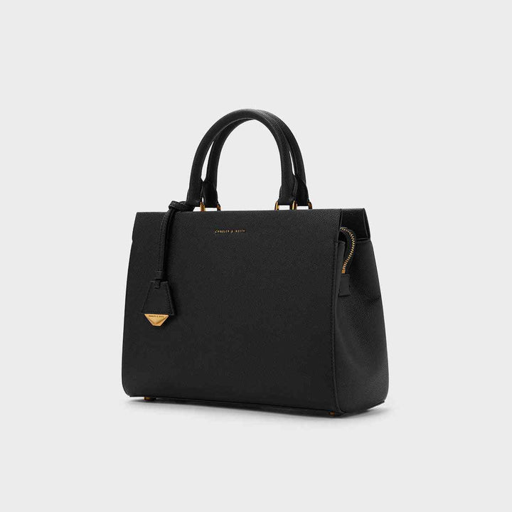 CHARLES&KEITH Mirabel top handle black bag with gold-tone accents.