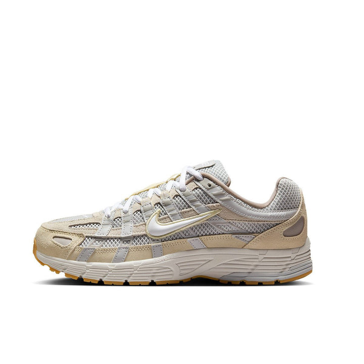 Nike P-6000 beige sneaker, featuring new design, yellow rubber sole, mesh upper.