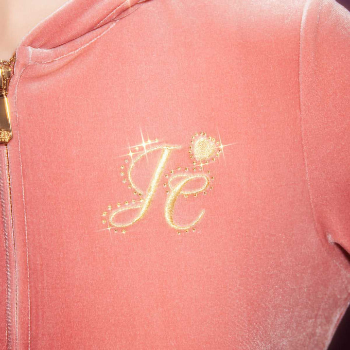 Pink velvet jacket with gold zipper and Juicy Couture embellished logo.