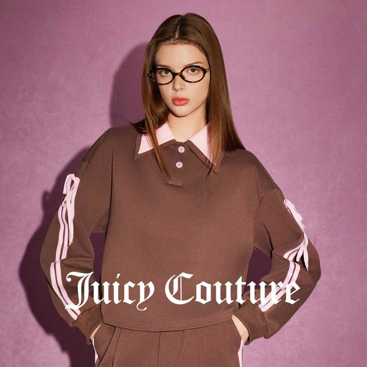 Juicy Couture brown and pink sports top with polo collar and long sleeves, featuring elegant accents.