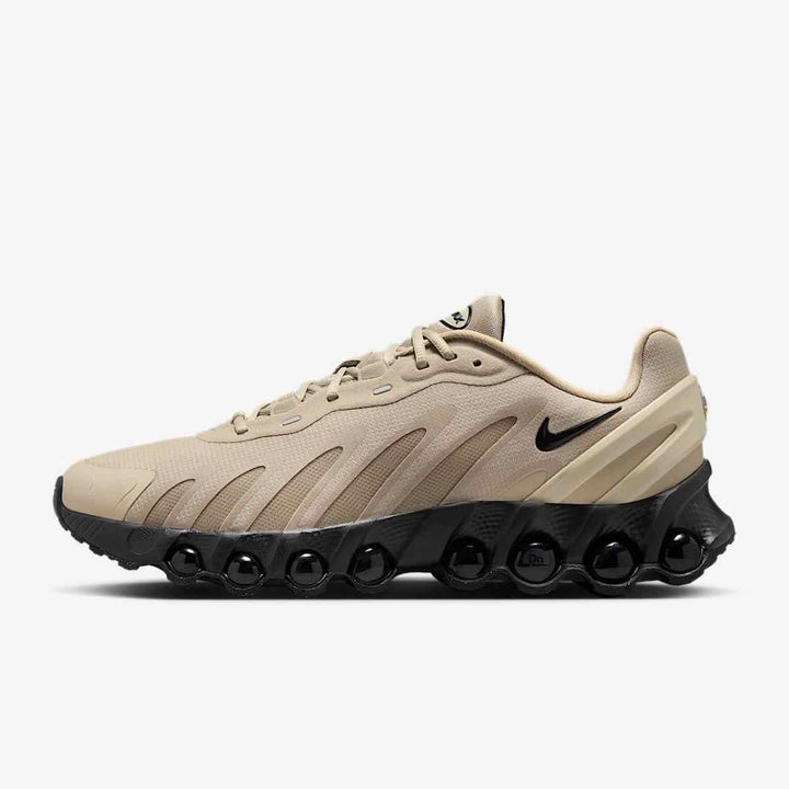 Nike Air Max DN8 low-top shock-absorbing men's sneakers in beige with black sole and swoosh.
