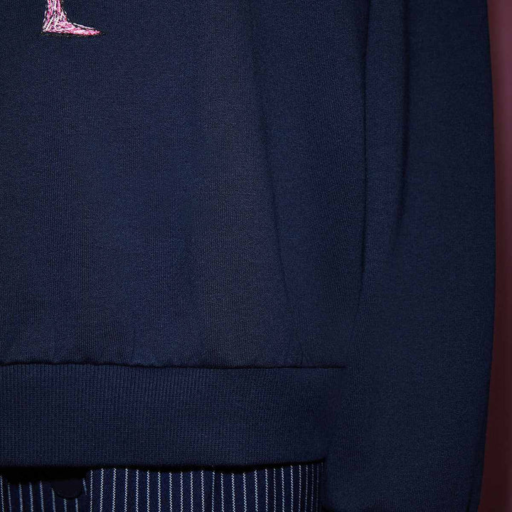 Juicy Couture navy sweatshirt with pink flamingo embroidery.