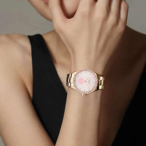 COACH women's pink watch.
