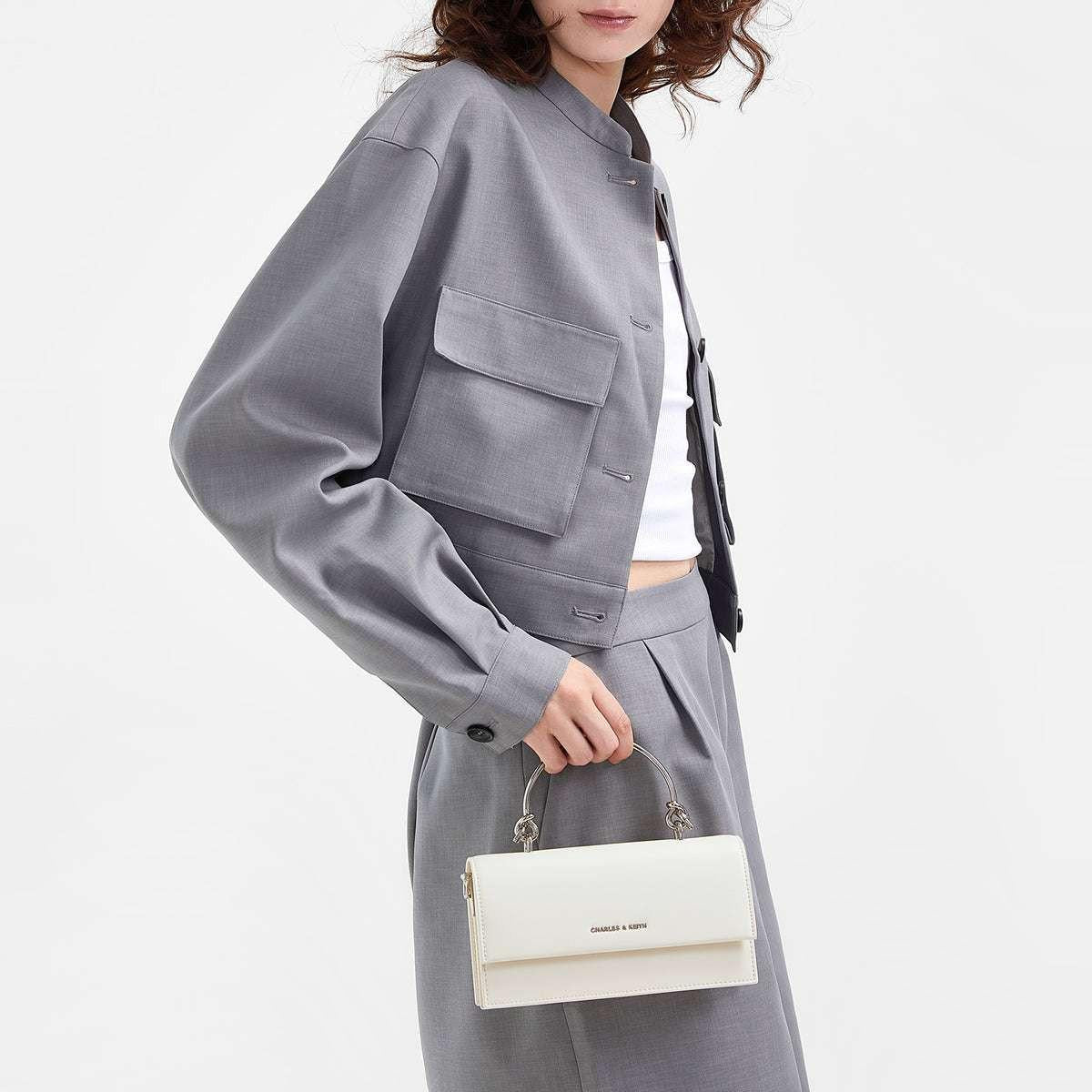 حقيبة Charles & Keith بمقبض علوي معدني وتصميم Crossbody.