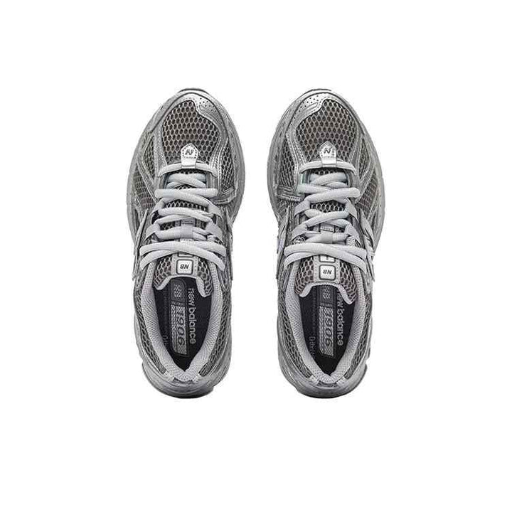 Top view of metallic silver New Balance 1906R breathable running shoes with white laces