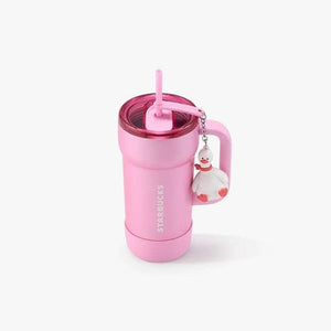 كوب Starbucks وردي مع يد وميدالية بطة لطيفة.
