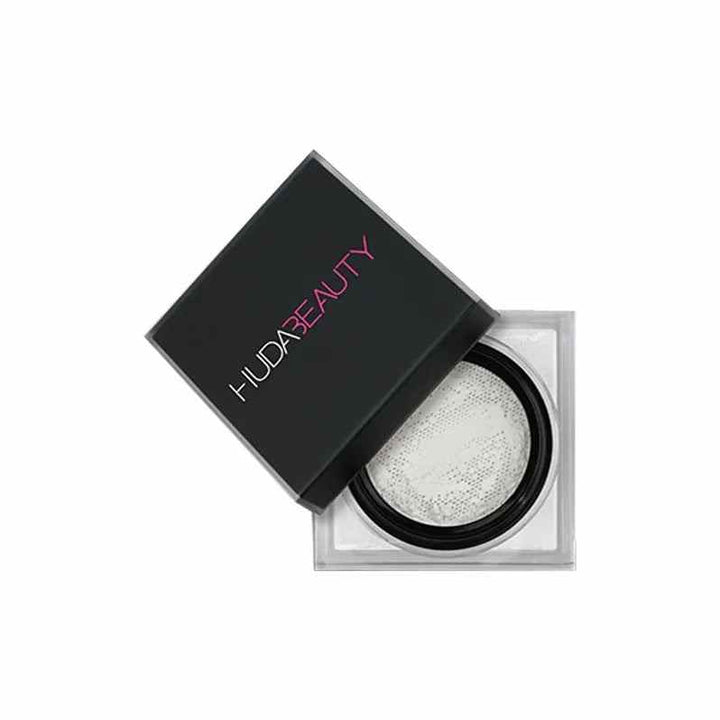 Huda Beauty Easy Bake Loose Powder in clear container with black lid for matte flawless finish
