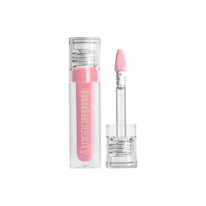 Huda Beauty Lip Gloss Collection pink shade with clear tube and applicator wand for silky smooth lips and vibrant shine