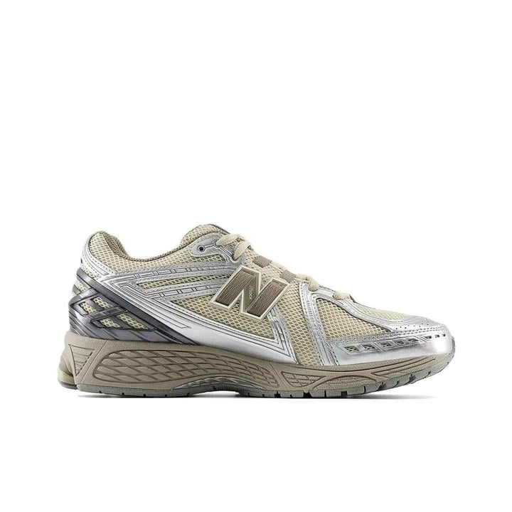 Beige New Balance 1906R sneaker with silver accents and breathable mesh design