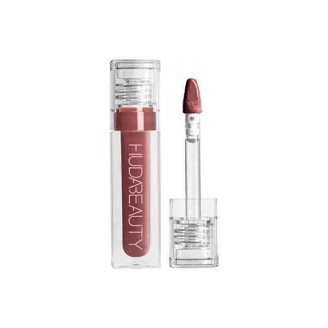 Huda Beauty Lip Gloss Collection in a sleek transparent tube with a soft pink shade and applicator wand displaying silky, glossy texture.