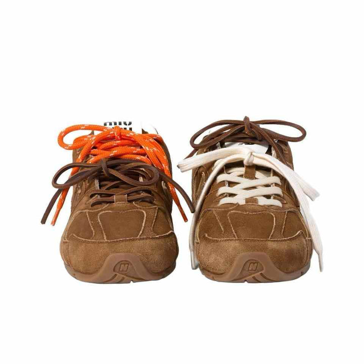New Balance x Miu Miu suede sneakers with dual laces in brown.