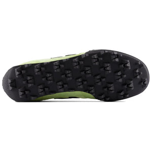 Bottom outsole view of light green and black New Balance RC30 shoes, featuring a black rubber tread pattern with exaggerated angular studs across the entire sole.