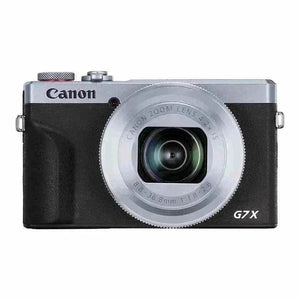 Front view of the silver and black classic edition Canon PowerShot G7 X Mark III camera with the lens fully retracted.