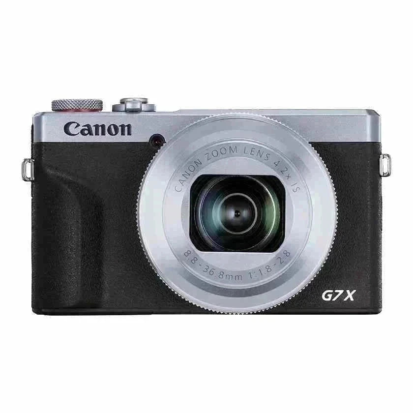 Front view of the silver and black classic edition Canon PowerShot G7 X Mark III camera with the lens fully retracted.