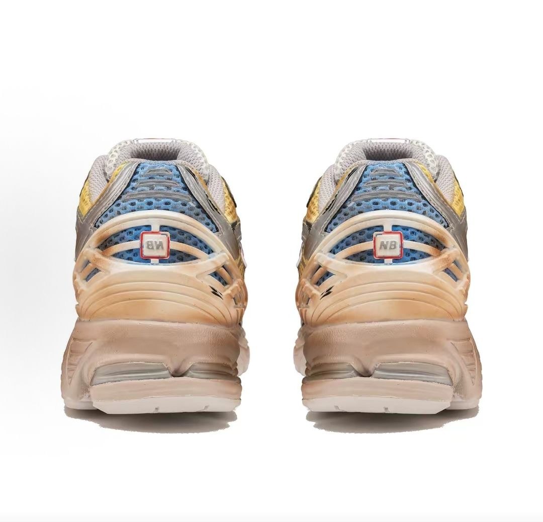 Custom Gundam theme New Balance shoes 1906R model, rear heel view highlighting distressed TPU cages, blue mesh underlays, cell-shaded comic line art, and weathered vintage midsoles.