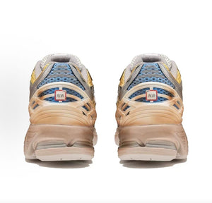 Custom Gundam theme New Balance shoes 1906R model, rear heel view highlighting distressed TPU cages, blue mesh underlays, cell-shaded comic line art, and weathered vintage midsoles.