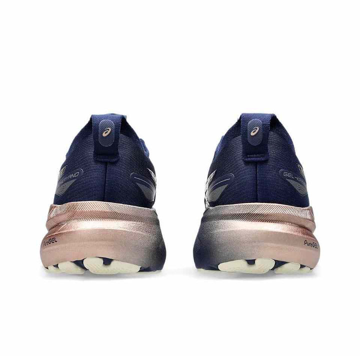 Rear view of GEL-KAYANO™ 31 running shoes with metallic details and cushioned sole.
