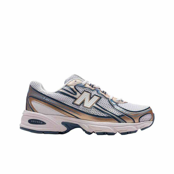 Side view of New Balance NB 740 sneaker with white and blue mesh upper and ABZORB midsole technology