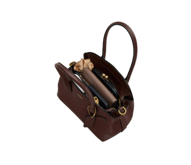 COACH Empire Carryall 21 حقيبة جلد بني داكن أنيقة بفصوص ذهبية وتصميم منظم عملي للرحلات والعمل