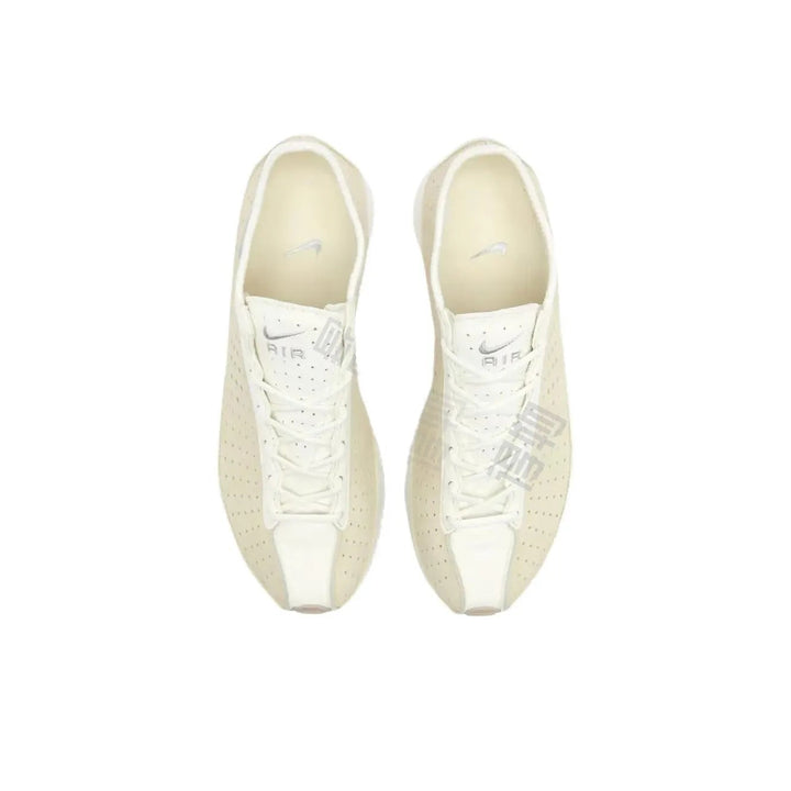 Pair of ivory Nike Air Zoom Spiridon Cage 2 sneakers with perforated upper and white laces, top view.