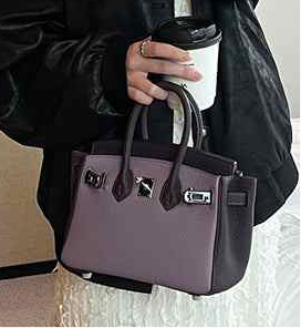 Lavender platinum bag with elegant metal details and leather accents.