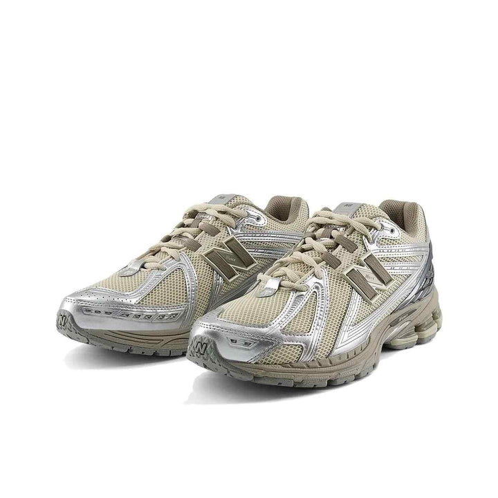 New Balance 1906R beige sneakers with silver accents, lightweight mesh, N-ERGY midsole cushioning, and durable outsole for daily casual wear