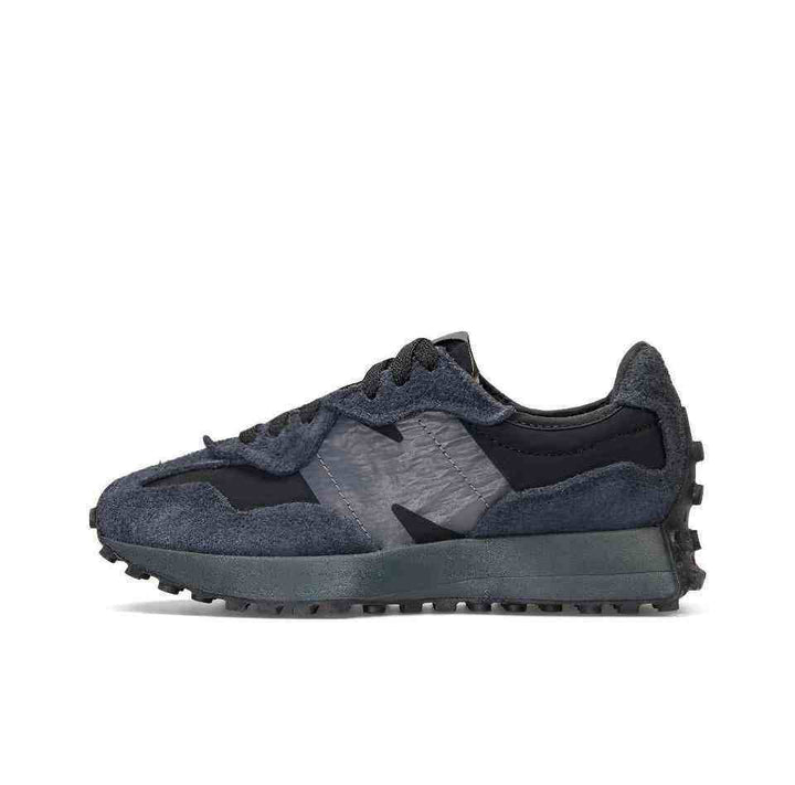 New Balance 327 sneaker in black fabric and suede, bold "N" logo, rubber outsole.