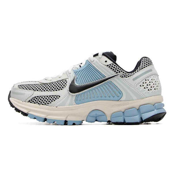 Women's Nike Zoom Vomero 5 sneaker with gradient colors, featuring durable synthetic leather, breathable mesh, and a cushioned shock-absorbing sole.