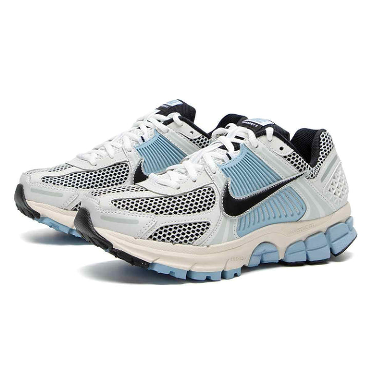 Nike Zoom Vomero 5 women's sneakers in gradient colors with leather accents, breathable mesh, and cushioned sole.