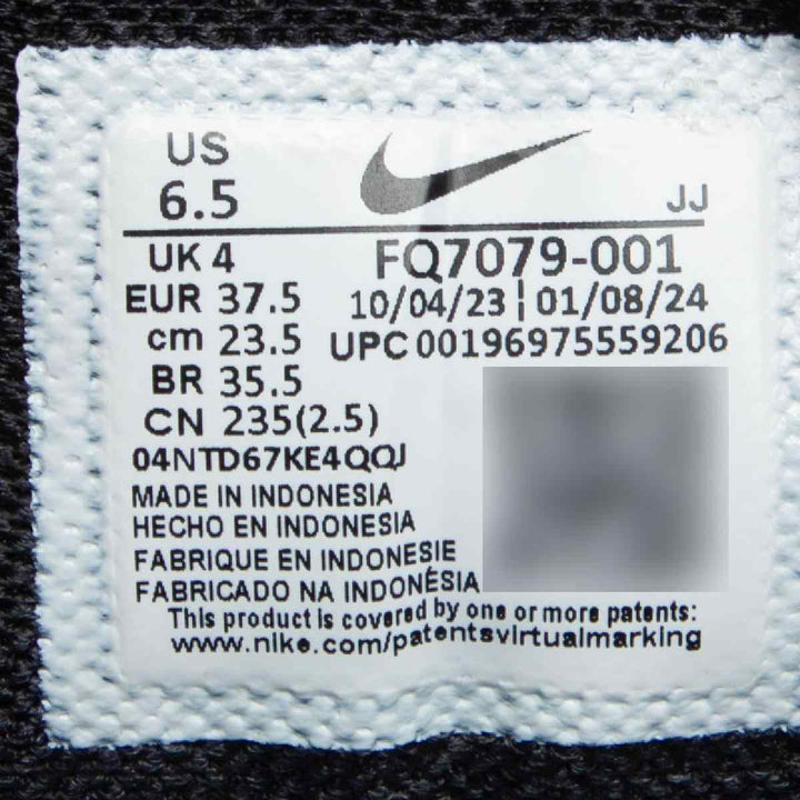 Nike Zoom Vomero 5 women's shoe label with size and product details.