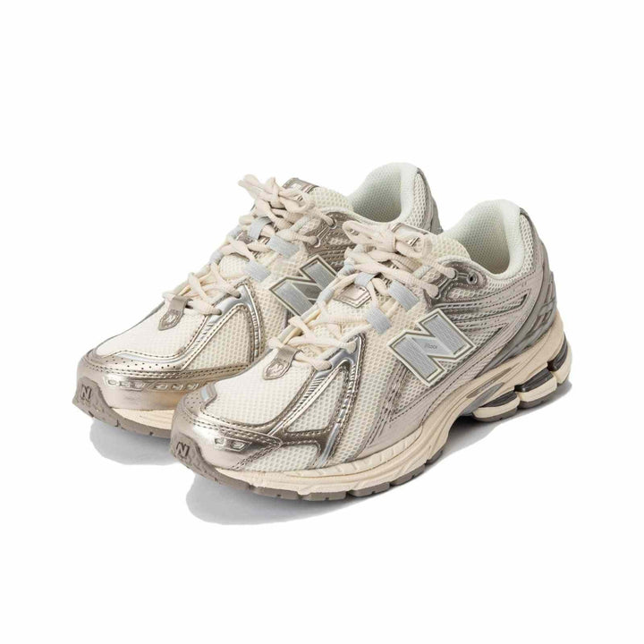 New Balance 1906R beige sneakers with silver accents, lightweight mesh, and N-ERGY cushioning for comfort and durability