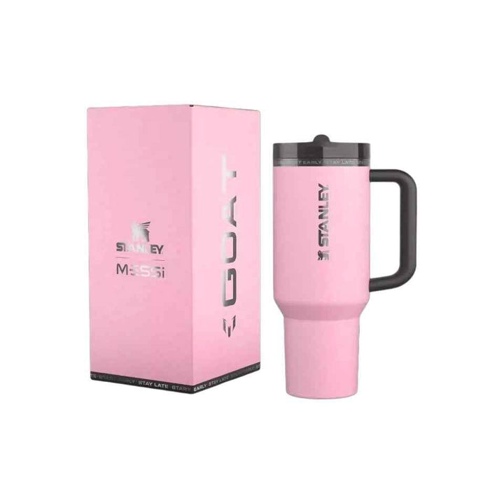 Stanley pink Messi edition thermal mug with black handle and matching pink box, leak-proof lid, ideal for hot and cold drinks.