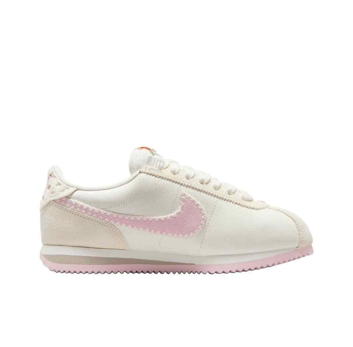 Nike Cortez women's classic casual walking shoe in white with pink swoosh and lightweight design