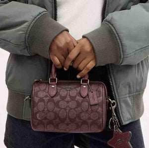 حقيبة Coach نسائية Mini Rowan Satchel لون عنابي.