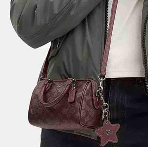 حقيبة Coach نسائية Mini Rowan Satchel لون عنابي.
