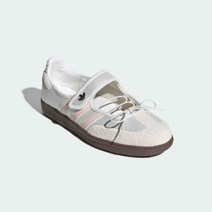 White and blush Adidas Samba Mary Jane shoe with pastel details, Velcro strap, leather upper, and chocolate rubber sole.