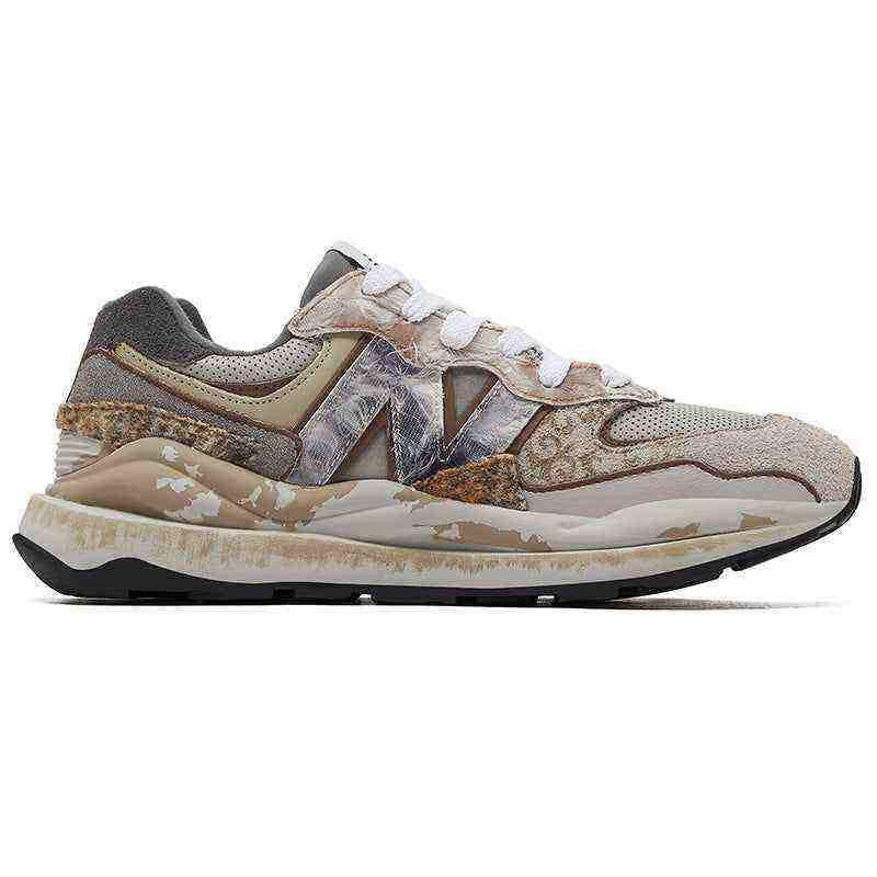 Medial side profile view of custom distressed multi-patterned New Balance running shoes.