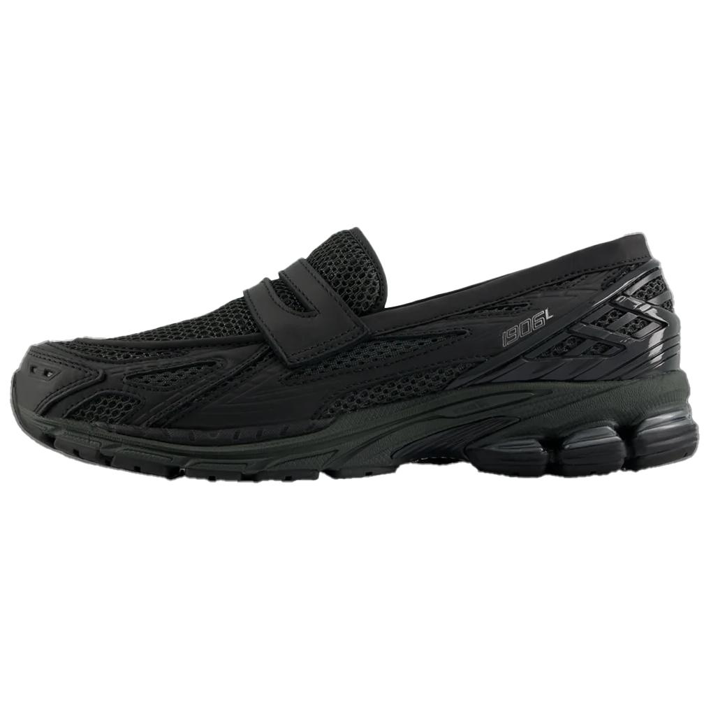 A lateral profile shot of the New Balance 1906L Black, showcasing its sleek mesh and leather upper. This versatile حذاء نيو بالانس combines athletic comfort with loafer style.