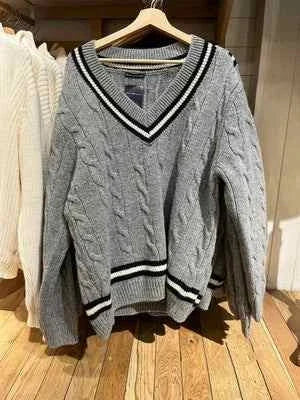 Classic winter cable knit sweater with striped edges in gray and black
