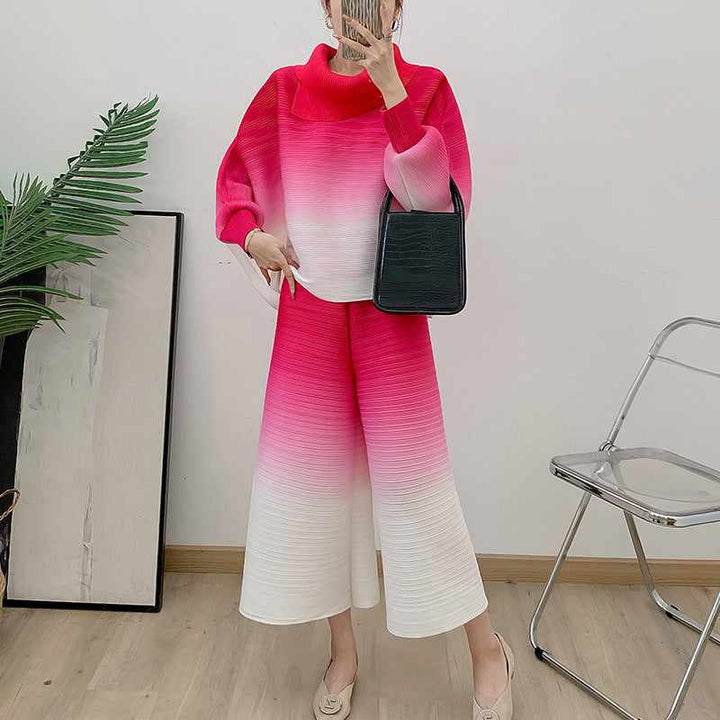 Pleated gradient suit 2025 spring in vibrant colors with a high-neck top and wide pants.