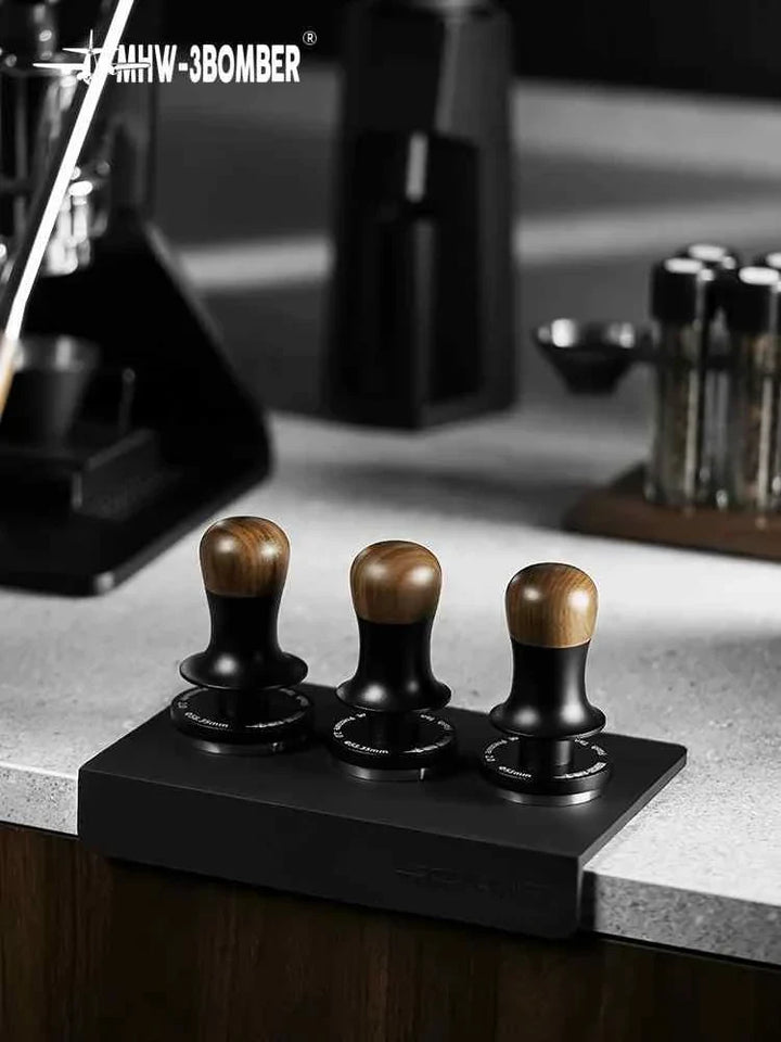 MHW-3BOMBER Espresso Coffee Tamper Set 2.0 with wooden handles and stainless steel bases on black holder.