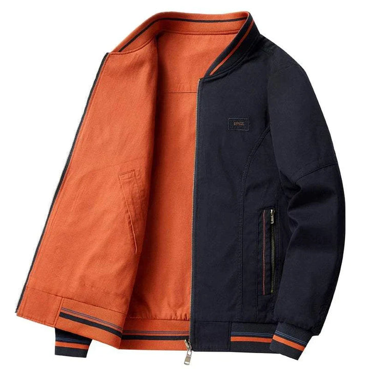 جاكيت لونين رجالي عكسي خامة كانفاس مع بطانة قطنية بألوان أسود وبرتقالي تصميم عملي وأنيق بسحّاب مزدوج وجيوب آمنة