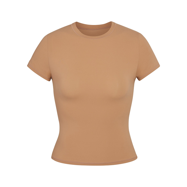Skims short sleeve slimming shapewear t-shirt in tan with crew neck and stretchy fabric.