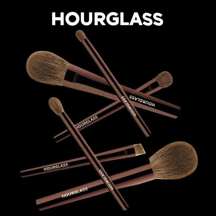 Professional Hourglass makeup brush set with 7 soft bristle brushes and elegant leather case.