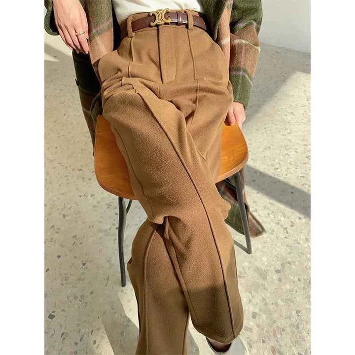 Women's classic fit formal trousers in luxurious fabric, brown color, styled with a belt, perfect for office and elegant looks.