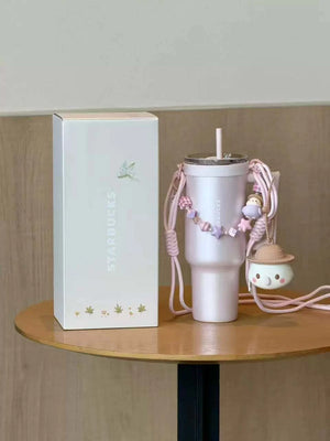 كوب Starbucks Tumbler وردي بمقبض وحزام للكتف.