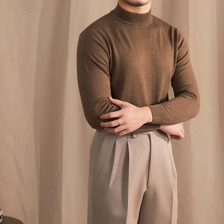 Mr. Lu San's 30% wool slim fit half-high neck sweater in brown with ribbed cuffs and hem, styled with beige trousers