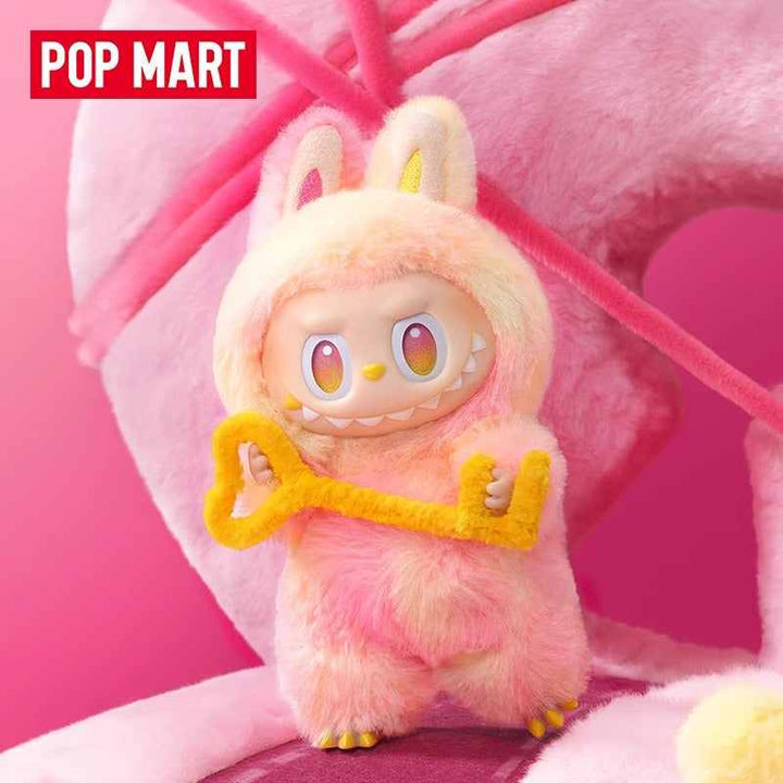 Pop Mart x LABUBU high energy series fluffy pink doll with key accessory.